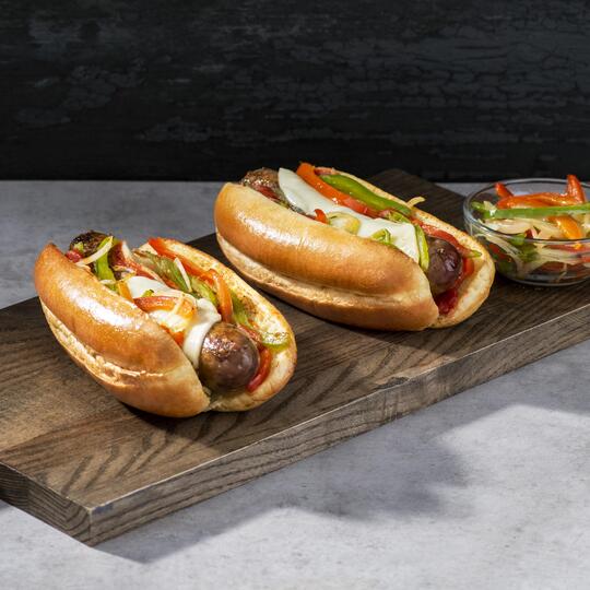 Grilled Italian Sausage on a Bun with Cheese and Peppers 